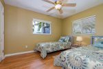 Sunset Point 3rd Bedroom with view to the pool featuring two twin beds